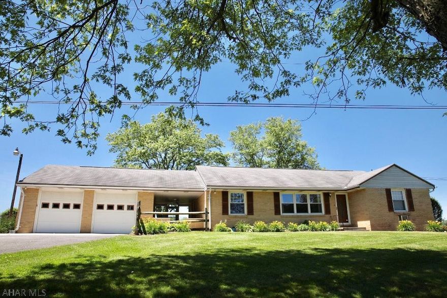 Priced to sell brick ranch in Breezewood, lovely view from the back. Easy care landscaping, 2 car attached garage, breezeway, 2 bedroom, 1/5 bath upstair, den w/ wood fireplace. Basement could have a 3rd bedroom. New carpet in living, hardwood floors under bedroom carpet and den.