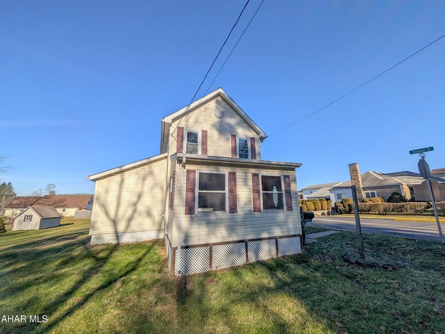 Portage area vinyl 2 story home with nice, level yard adjacent to Critchton McKormick Park! Features large galley kitchen, formal living room, dining room, enclosed front porch, laundry/mudroom and full bat on first floor. Three bedrooms (one is captive) upstairs plus attic storage.  Buyer to pay any required municipal sewer testing and/or repair escrow. AS-IS sale, seller will make no repairs.