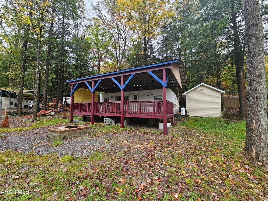 2006 30' camper on 1 lot inside Glendale Yearound. Camper has a large deck attached to it and a pavilion over camper and deck. Everything works in camper. Camper is clean and in good condition. Campsite is only a few minutes walk from small fishing pond. Shed included also.