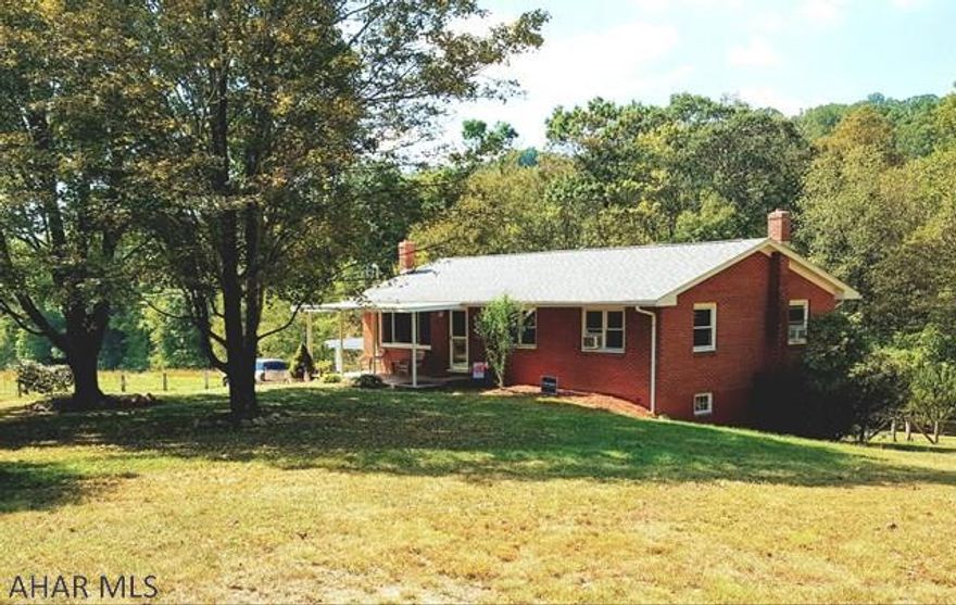 Beautifully updated one story ranch surrounded by nature adjacent to open land, mountain view to the south and abutting Evitts Creek. State game lands/fishing are near by. Beautiful renovated kitchen opens onto a serene back deck/yard with calming nature sounds of a babbling brook. Kitchen comes complete with new custom maple/shaker cabinets, appliances, counter tops/flooring. This home is freshly painted throughout in neutral grey tones w/bright white crown moldings/baseboards that contrast nicely w/new dark hickory laminate flooring. Lower level finished family room w/wood burner, laundry, bath, kitchen area and bonus room. The large heated one car garage w/workshop/carport/storage. New covered porch. New energy efficient heating. Updates too numerous to mention.