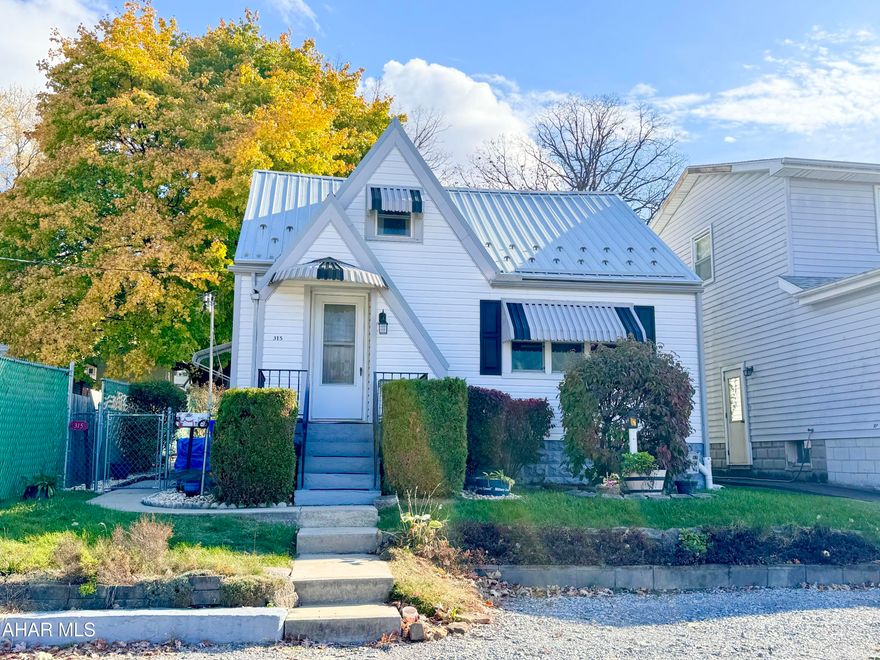 I bet Hansel and Gretel's Cottage wasn't as cute as this one!! Located in the heart of Lakemont, there's so much to love about this location.  Enjoy Summer nights watching the Fireworks from the Curve, or on the back patio under the awning. Inside you'll find much more space than you think.  With a spacious living room, half bath, dining room, and kitchen on the main level it wouldn't be complete without laundry.  Upstairs you'll find a full bath, 2 bedrooms, and the perfect Nook for reading or crafts! (Or a smaller 3rd bedroom with built in dressers!) The basement is large enough for all of your storage, and there's off street parking!  One space out front, and the possibility of more out back.  Call today to see if this adorable cottage could be your next home!