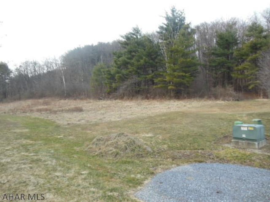 Tucked away 2.31 acres in East Freedom with electric, sewage, at the lot line.  A stream runs along the lower line.  Beautiful views of mountains and area openness, nice and new homes locally, and semi-private presently, but could be bordered more with trees, shrubs, or fencing for more privacy.  About 40% wooded, and has wildlife and peace.  Rt. 220S. turn right onto Rt. 164, Cream Hollow area turn right onto Fall View, then left onto McDowell Road to end...