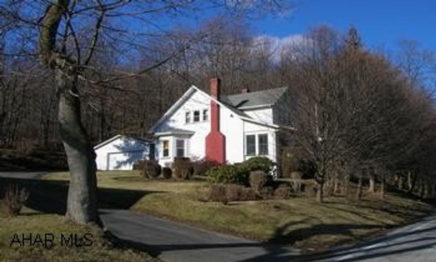 Attractive 1 1/2 story in very good condition. 3 bedrooms, large closets, many extras, and very large lot.