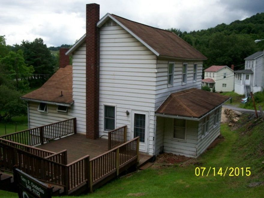 2 story, 3 BRs with hardwood floors, large deck. Metal shed