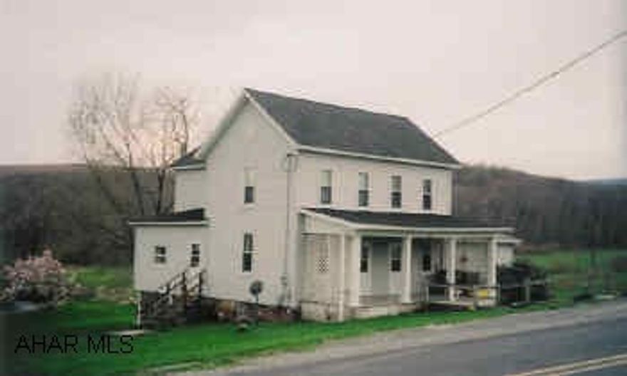 Large 2-stor farmhouse in country setting. 14.7 acres with a stream, great for horses.