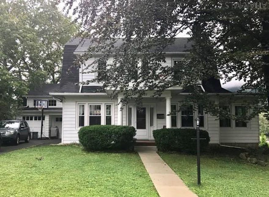 Lovely Dutch Colonial located on a charming quiet street in the heart of Bedford. The home boasts the most wonderful curb appeal and is surrounded by nature. The spectacular yard has been professionally landscaped and is sure to please even the most discriminating buyer with its size and beauty. Lovely wood moldings and built in cabinets add to the charm of this home. Replacement windows and whole house insulation ensure heat efficiency. Recent updates include refinishing floors throughout, updated furnace, new sidewalks, new bathroom, newly painted garage, new porch floor and ceiling, new dishwasher. Walking distance to schools, tennis courts, downtown shops and restaurants make this an ideal in town location.