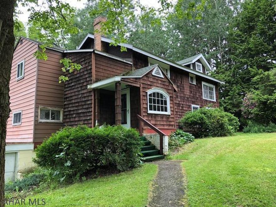 Privacy abounds, large 2 story home situated on 5+ acres. This home has much potential. Home is in need of many updates. Could be a beautiful home once updated.