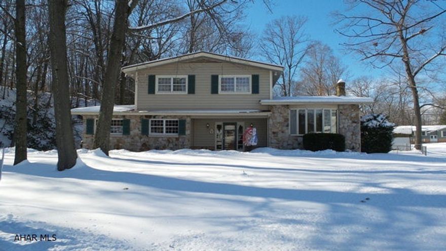Exceptional four bedroom multilevel in Tipton, Lower Johnson development.  Newer kitchen featuring Corian counters, appliances stay and leads to a covered deck that overlooks a private spacious back yard.  Formal living room, and over-sized family room with fireplace and large windows for a lot of natural light!  Two car garage, public water and sewer, central air.  Overlooks Tipton Run.