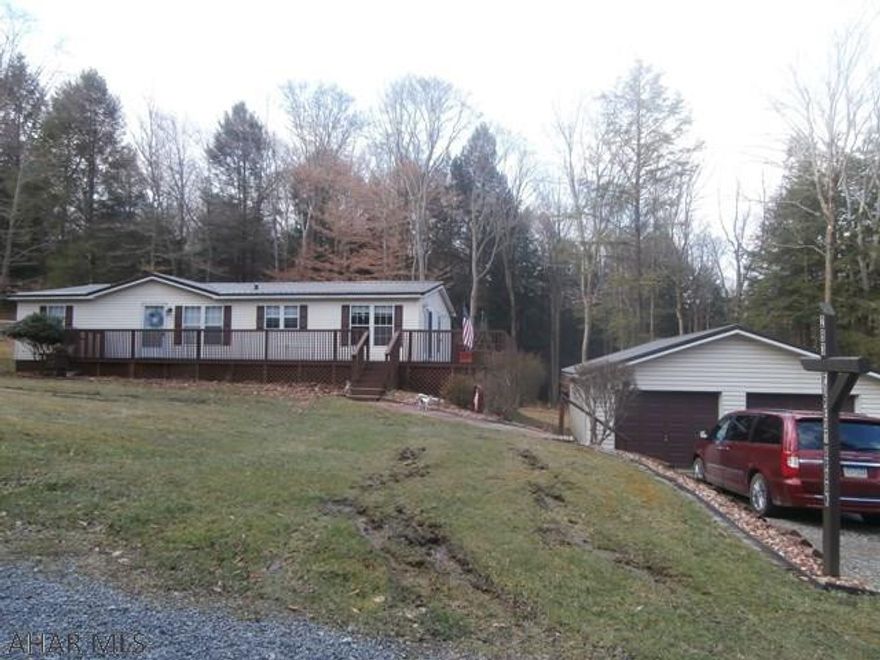 Very clean and well maintained double wide containing 3 bedrooms and two baths. Large living room with fireplace, vaulted ceiling, large deck and rear atrium. Two lots and detached two car garage. Great home for the $$.