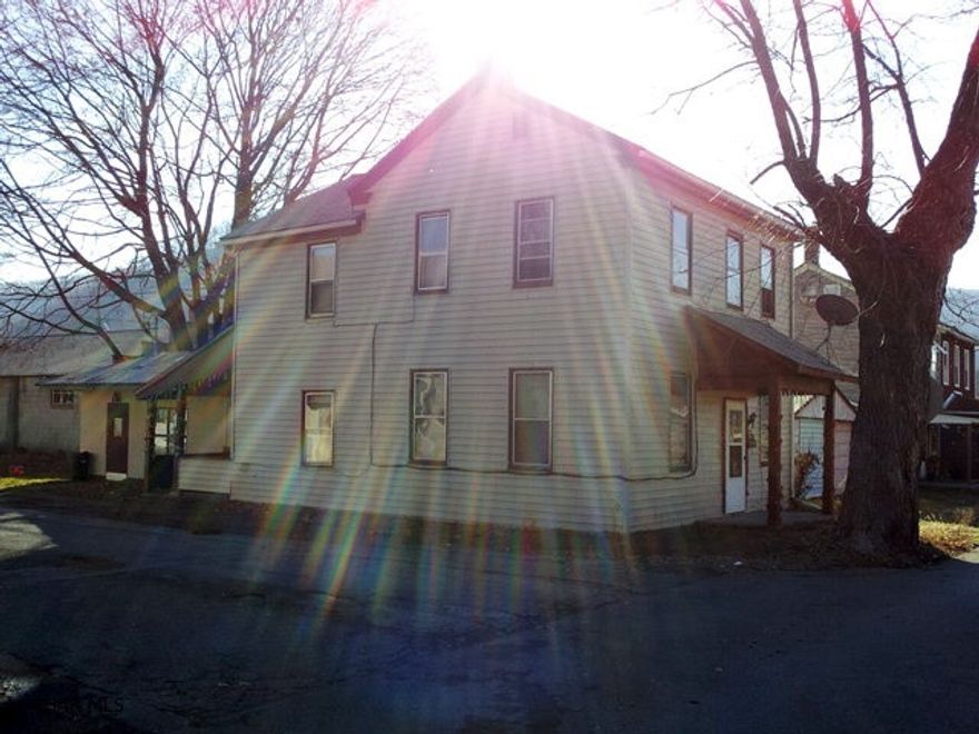 2 1/2 story, 4 bedroom home with additional shop. 1st floor laundry. Garage`