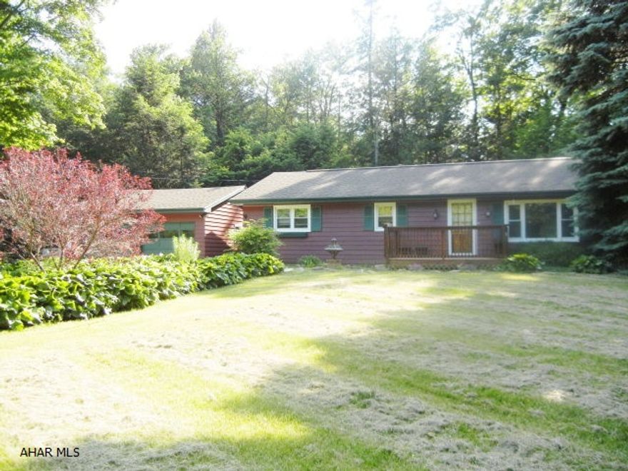 Secluded and Serene best describe this 3 Bedroom 1 Bathroom home on 1.6 acres.  Watch the wildlife from the deck or the beautiful Florida Room.  Two Car Garage, Fireplace in Living Room (Requires Repairs).  Pull down stairs to attic storage.  New furnace in 2009.  Newer roof, water heater, and deck.  Won't last long!  New septic tank installed 8/30/2011.