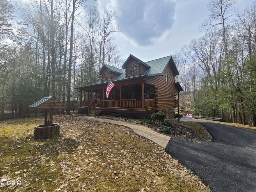 Beautiful log home situated on 1/2 acre lot inside Glendale Yearound with 2 bedrooms and 2.5 bathrooms. 2 car detached garage and 1 car integral garage with a paved driveway give you plenty of parking. Professionally landscaped patio with firepit and grill area. The inside of the house is rustic with exposed beams and open loft area which gives off a real mountain cabin experience. The open loft area has 3 beds so you can fit everybody in this house. Laundry is on the 1st floor. Almost everything stays in this house. It is move in ready!!! Glendale Yearound is a gated community located minutes from Prince Gallitzin State Park and Glendale Lake. Community pool, tennis, basketball, and more.