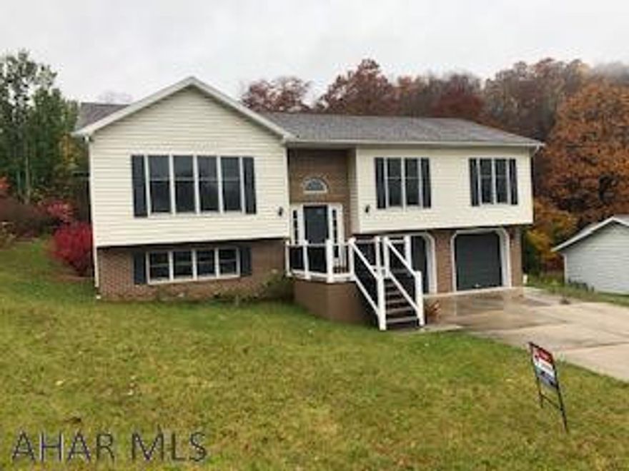 Fresh interior paint and new carpet so you can move right in.  Vaulted ceilings, covered deck, 2 car garage, 2.5 baths, 3 BRs and lower level family room is included.  Make sure you check this one out! Buyer or agent to verify sqft and taxes.  Please remove shoes...carpet is new.