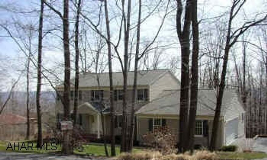 STONEHEDGE. ELEGANT COLONIAL IN QUIET WOODED SETTING. THE INTERIOR OF THIS HOME FEATURES MANY UPGRADES SUCH AS HARDWOOD FLOORS, LARGE MASTER BEDROOM WITH CERAMIC TILE BATH AND LARGE CEDAR WALK-IN CLOSET.  HOME WARRANTY INCLUDED!!!