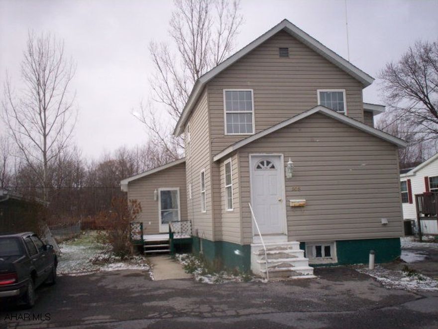 2 Story vinyl sided res., kit., d.r., family room, 1 bath downstairs, mud room, den, and laundry room on first floor, 3 bedrooms on 2nd floor, attic storage, on a 50 x 120 lot.  Pending action to quiet title thru attorney Terry Goldstein, Altoona, PA.