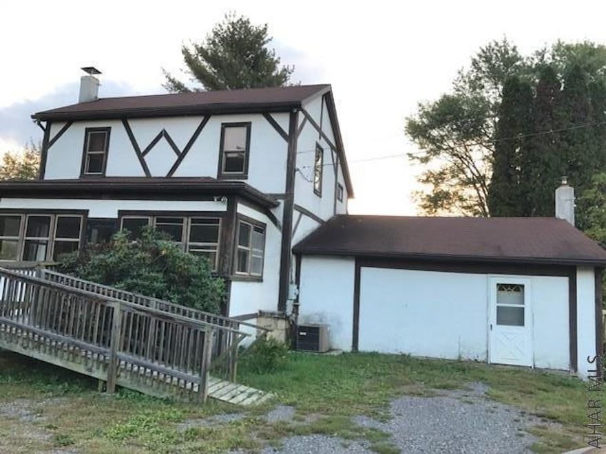 This is an older single family home on approx. 4.74 acres, .Three bedrooms, one bath, eat in kitchen that leads to a rear deck. Laundry room on first floor with a 6x10 bonus room adjacent to it,, sliding door in the lower level opens to your spacious backyard.  It has cedar lined closets downstairs, and in the living room. The upstairs has two bedrooms  with closets and a bonus room or could be used as third bedroom.  Some updates and a little elbow grease will make this house your beautiful home.