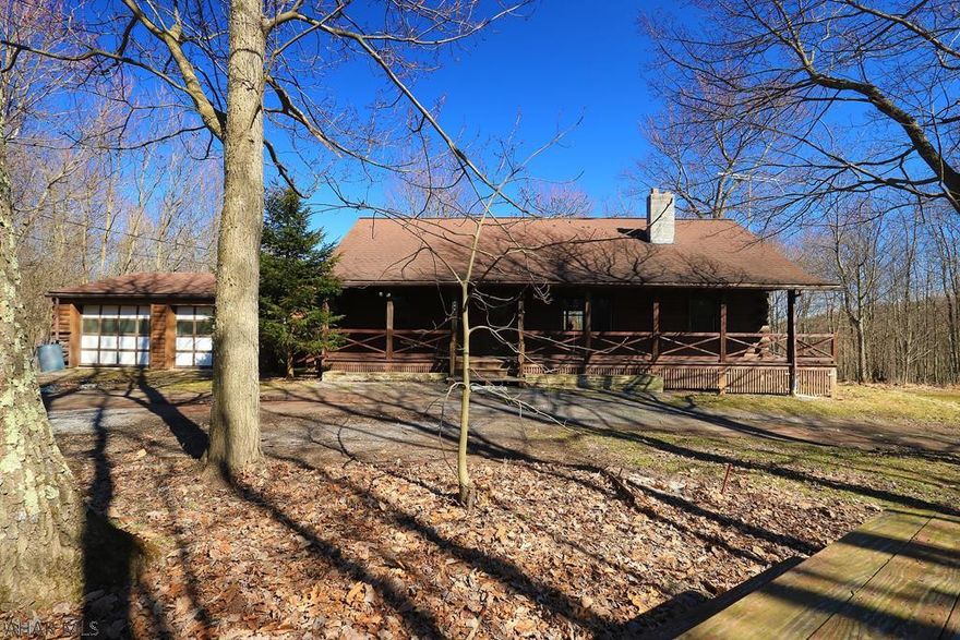Graceful Tranquility. Resting peacefully on 44.07 secluded acres framing the setting for this cozy log home. Blending harmoniously with the peaceful surroundings. The welcoming wrap-around porch leads to the living rm w/laminate flooring & a soaring vaulted ceiling with exposed beams open to the 2nd floor. There is a dining room, kitchen, 1st-floor den, first-floor master bedroom, another bedroom & a full bath. Upstairs you will find 2 bedrooms & a full bath. The walk-out basement provides plenty of storage & can easily be finished for additional living space. Additional highlights include oil forced air heat, rear covered deck, 2 car garage & woodshed. Escape from the everyday hustle & bustle, truly a commuter's dream only 14.5 miles from State College.  Currently enrolled Clean & Green.