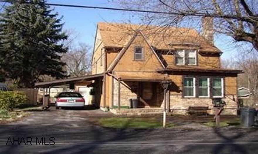 2.5 STORY.  REAR SUNROOM WITH ALL NEW WINDOWS, NEEDS FINISHED. BASEMENT PARTIALLY FINISHED. LOGAN TOWNSHIP. GREENWOOD. LARGER THAN IT APPEARS. INTERIOR FEATURES BEAUTIFUL STONE FIREPLACE AND BEAUTIFUL DOORS  AND WOODWORK. A DIAMOND IN THE ROUGH.