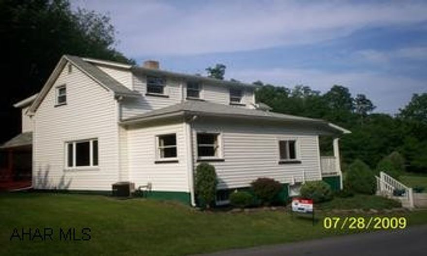 3 bedroom, kitchen-dining room combo, LR, bonus room, laundry room and den, 1 full bath, 1/2 bath on first floor; kitchen is oak, updated; withfull bath upstairs; 2 stall detached garage on 1.3 acre; new septic on 3/09; newer furnace; 150 AMP electric; newer roof; large back porch. Property Vacant at present call Dan.