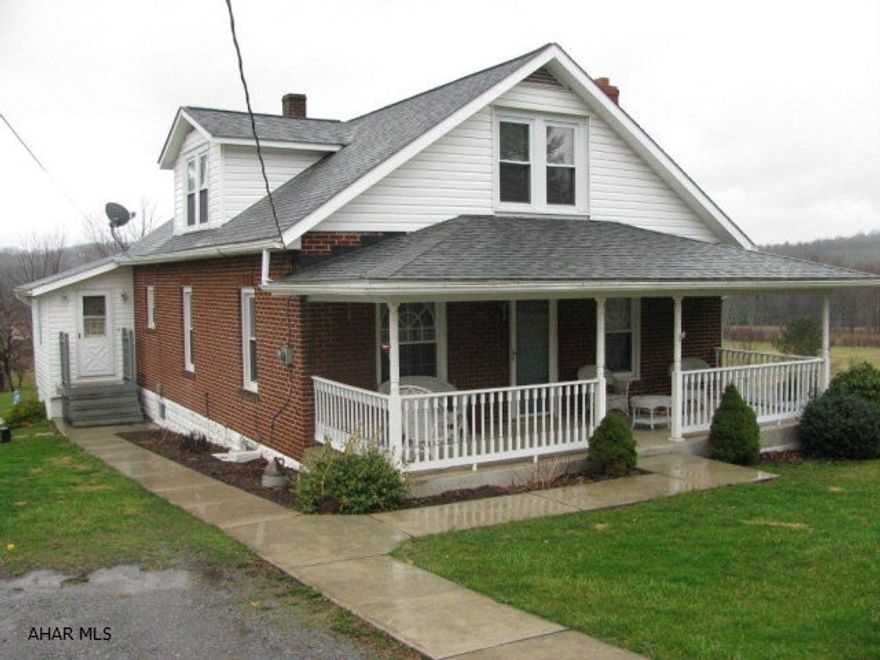 Charmimg Brick Cape on 1.5 acres in Antis Twp, Bellwood Schools!, 2 car detached garage, LR, DR, Large EIK w/oak cabinets & appliances, 4 BR, 1.5 Bath, oversized 2 car detached garage, combo wood or oil furnace. $3000 carpet allowance