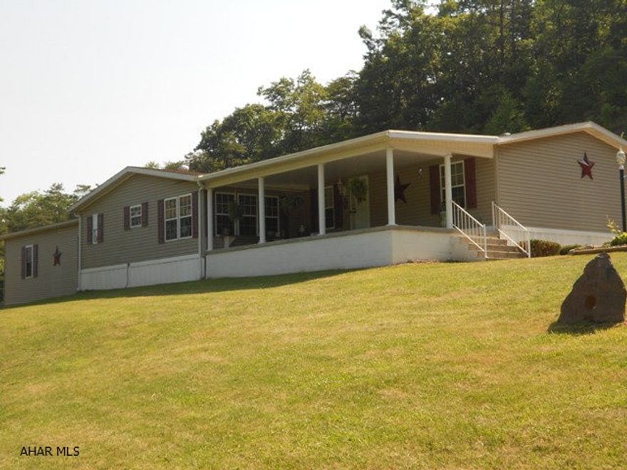 NBC school district. Great location for this triple size 1995 doublewide on 4 +/- acres. Great views from the covered front porch. Has 3 BR and 2.5 baths. Seller added a 34x32 oversized attached garage. Whole house is spacious, just waiting for you to buy!