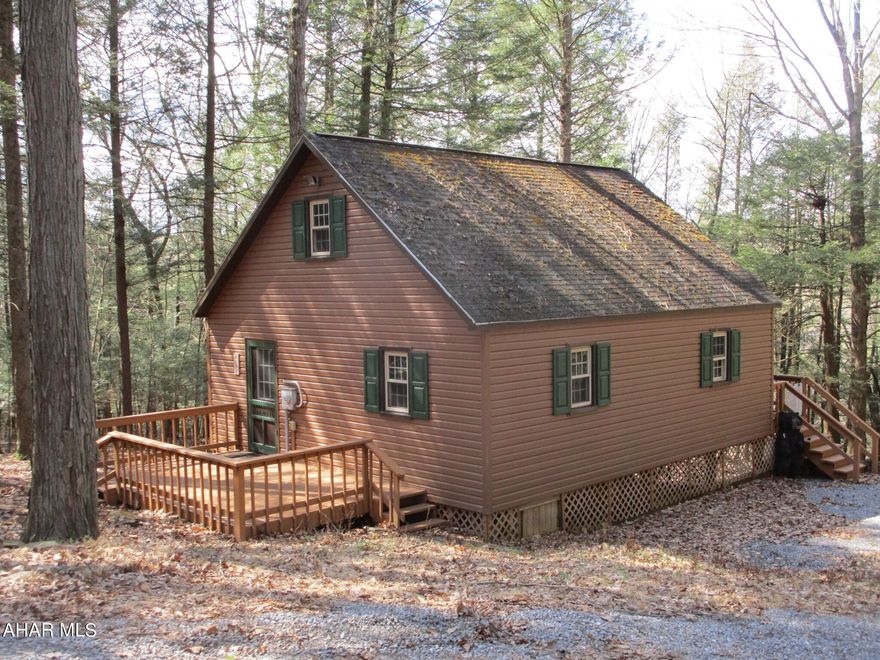 Looking for a private getaway cabin in the woods?  This gem sits on three lots, almost 1.25 acres of woods in a cul-de-sac.  All first floor living except for the loft.  This cabin has been well maintained and is just the right size if you are looking for low maintenance.  You will enjoy sitting on the back deck watching the deer and other wildlife.  The shed and space under the cabin offer room for storage.  Although the home is nestled in this private circle it is located not far from the clubhouse and pool area.
Most of the furnishings and house goods stay with the home along with some of the tools in the shed and the golf cart.
Make some memories with your family here!

Located in Glendale Yearound, a gated community that has a club house, outdoor swimming pool, tennis/basketball/volleyball courts, playgrounds, dog park, ball field, etc.  Adjacent to Prince Gallitzin State Park / Glendale Lake and six miles from Rock Run ATV Park.