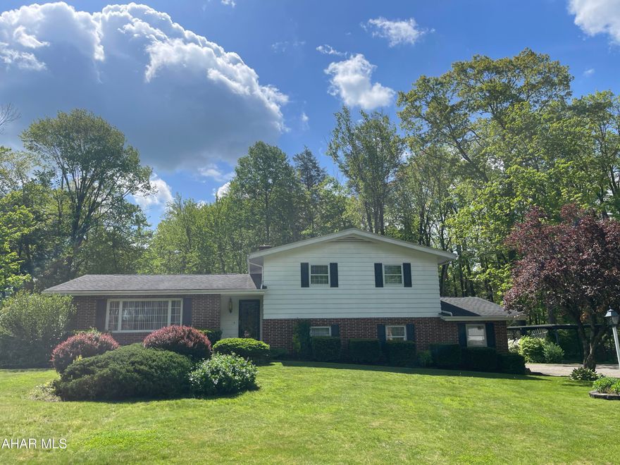 LOCATION, LOCATION, LOCATION! Welcome to 'upper Johnson' development.   This home has been well cared for and offers 3BR, 1.5 BA. Each bedroom has beautiful Hardwood flooring. 
 Lower level offers a Family room w/wood fireplace.  Enjoy cookouts on the spacious covered deck.   It is also nicely situated on .68 acre of level ground.  Also sits at end of cul-de-sac - so traffic flow is minimal.  It not only offers 2 car garage but a carport as well and a spacious shed.  The driveway is circular - so no need to back out - and there's plenty of parking for company - Attic access located in closet just outside full bath on 2nd floor