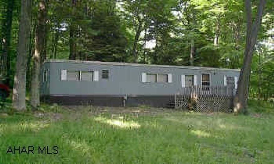Great Summer Home.  Nice 1 Bed Mobile home on 1/3 acre.  Assoc. Dues include: pool, tennis courts, trash, road maintence, snow removal