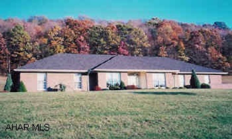 Custom brick ranch style home on 17.1 acres. Quality construction throughout. 3 bedroom plus 2 bedroom guest suite.  Home features cherry, walnut and oak flooring, tray ceiling in master bedroom, breakfast bar in kitchen. Two bedroom in-law suite.