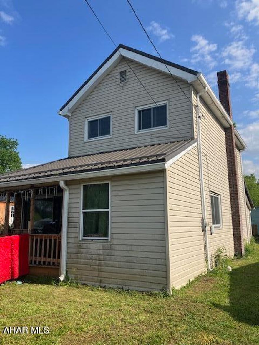 4 bedroom, 1 bath house on 1/4 acre in Portage. There is a ramp to the covered front porch. Newer front door leads to an entry with closet. Then there is a large combination dining room / living room with fireplace. There is a kitchen, full bath, bonus room, and laundry room on the first floor. Upstairs is 2 more bedrooms and a walk up attic. There is also a back porch and shed. Newer metal roof!