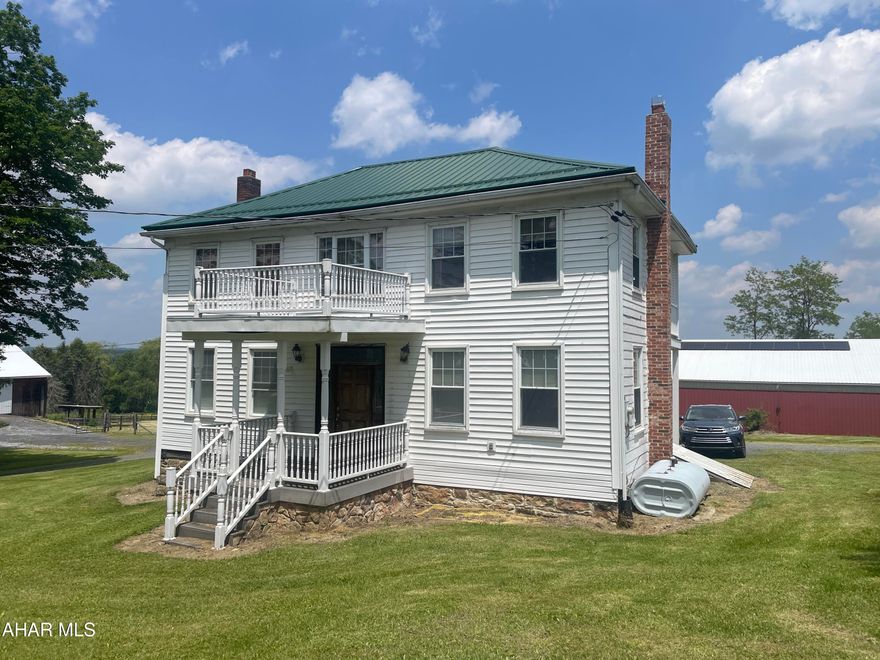 Classic farmhouse on 3.5 acres. 60x100 riding barn, 40x80 bank barn and 30x40 detached metal garage. Pasture area. 1.5 miles from Cresson on Old 22.