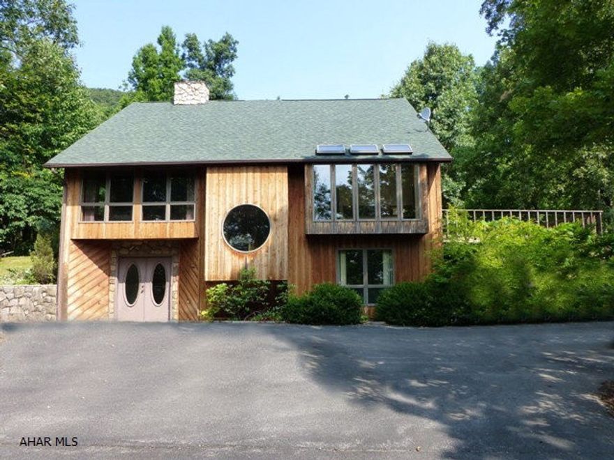 Tyrone/Taylor Township - Looking for a private setting and NOT seeing your neighbors?  Take advantage of this 15 acre beauty.  Contemporary, 3 levels, with a huge master bedroom suite.  Upgrades include newer roof and C/A.  Several out buildings on the property.  Please refer to additional photos.