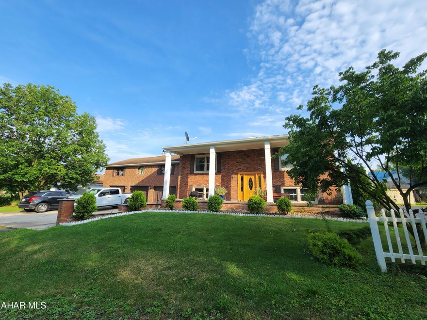 Large three bedroom two bath home in Hollidaysburg School District. Within the last year, the current owner installed windows, some flooring, a vinyl fence, and new furnace. This home is larger than it appears with tons of options. The main living floor offers a kitchen, bathroom, dining room, living room, den, and primary suite with sitting room and bedroom. The partially finished lower level offers a summer kitchen,  laundry, family room, bedroom, and bathroom. There is a large attached 3 bay garage with unfinished space above. The unfinished area above the garage could be finished for additional living space. The nicely fenced backyard is perfect for privacy and entertaining.