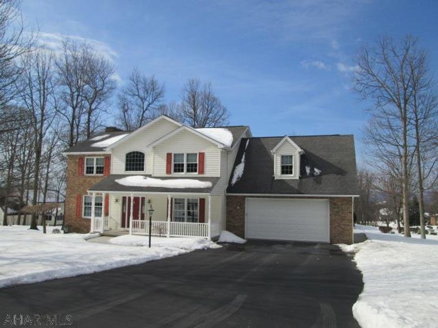 Sylvan East, Logan Township.  Immaculate 4 bedroom with 3.5 baths.  This beautiful home features updated hardwood flooring, family room with gas fireplace, island kitchen and heated sun room.  Newer large rear deck off the beautiful sun room.  The Master bedroom suite offers a double sink bath featuring a Jacuzzi tub and walk-in closet.  The finished lower level has a family room, bedroom, 3/4 bath and large storage area.  Don't miss this one on a large corner lot!