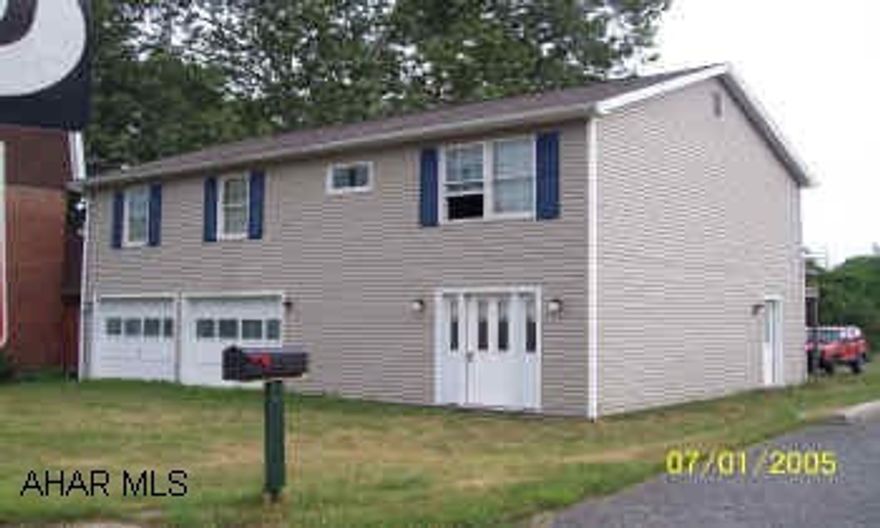 Raised Ranch home with in town convience This home has a large yard and a open floor plan