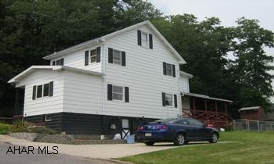 Spacious 3 BR home sitting on 1/3 ac. New roof, paint, hotwater heater and beautiful tiled kitchen countertops and bathroom. Fenced yard, nice covered deck& concrete driveway.You mut see to appreciate the value!Call John Farabaugh @ 329-2359. This home is situated on a large level 100x150 lot with a fenced area of the beautiful rear deck..Along with the many updates, and all the appliances included, it make this home a Great Value!!