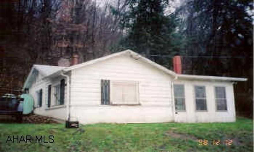 Hunters Paradise, cabin with 2 car detached garage with electric, adjoins state game lands. Back of property adjoins state game lands.