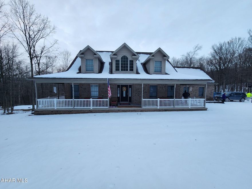 Coine home to this absolutely gorgeous piece of heaven.  Your new home has everything that you want and more.  Walk into the foyer where you will find cathedral ceilings and a living room where you can look out many of windows and see nature as you look over your wraparound porch.  You will also find a kitchen with custom cupboards, formal dining area, sunroom, office, laundry room and master suite with bathroom and walk in closet.  While in your sunroom and office you can open the French doors to your porch and look for miles through the woods.  Let's go upstairs where you will find 2 large bedrooms and a separate bathroom.  You want more?  You got it.  The basement is fully finished with family room, bar area, full bathroom and 3 other rooms that can be used for anything that you want.  Your dream home also has 4 car garage, concrete driveway and just under 10 acres.  Call me today to take your tour.