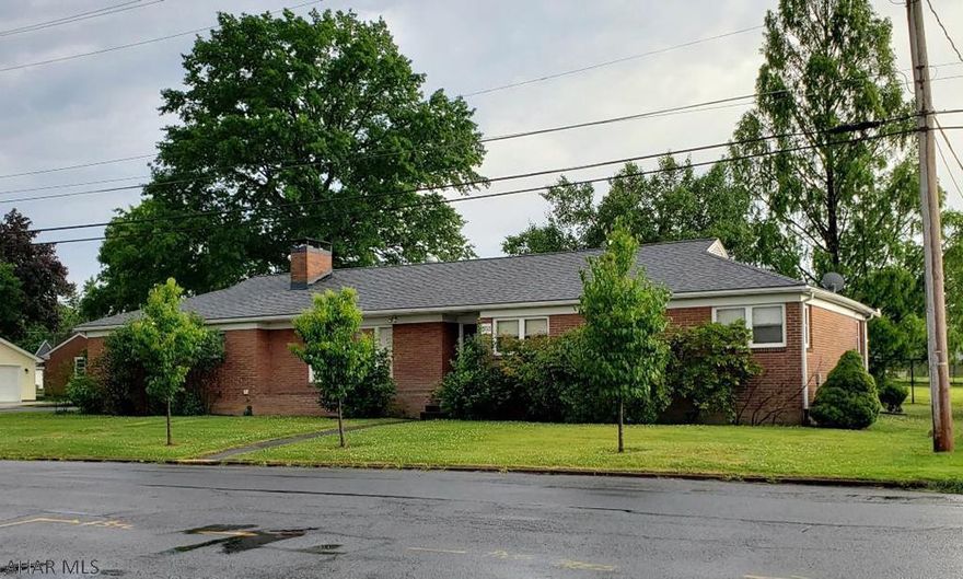 Great Location across from Hollidaysburg football field!  1-story 3-bedroom brick home with screened-in patio, nice kitchen w/built-in double oven & newer appliances, gas fireplace, built-in book shelves, natural gas forced air heat, newer furnace, air conditioning & heat pump.  Hardwood under carpeting.  2+car garage with pull-down stairs in garage for storage.  J-486