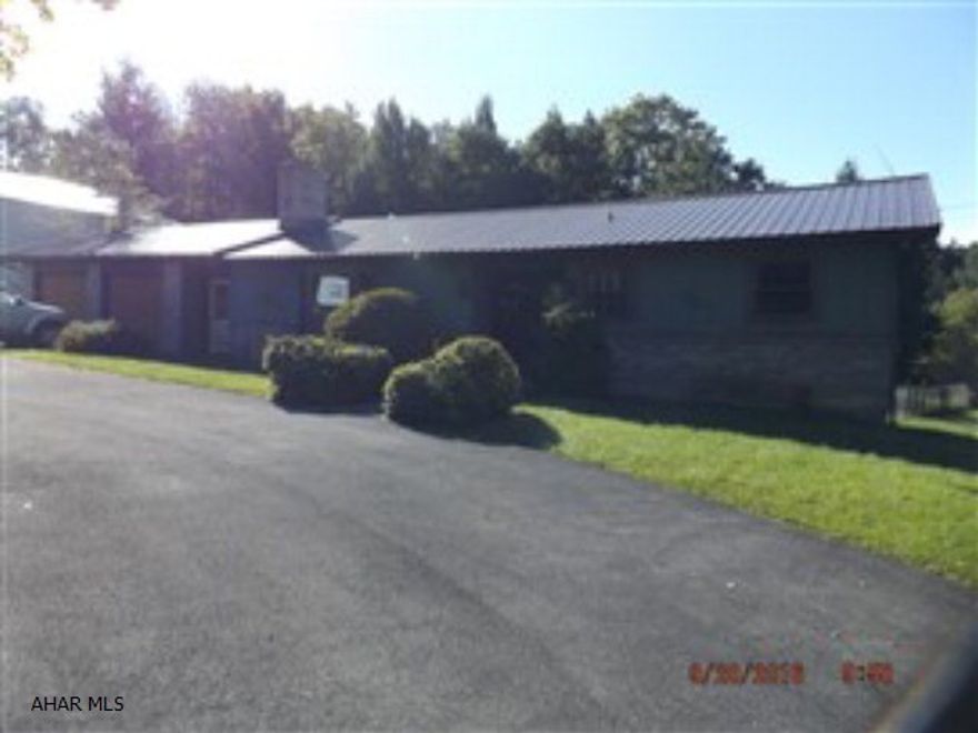 4 year old pole barn with concrete floor 42x42. Aluminum roof on home is 4 years. Oil hot water furnace is 4 years. In-ground pool has not been opened for 2 years.