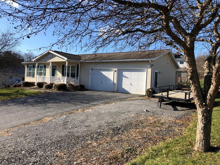 This 2 bedroom 1.75 bath ranch is perfect if you are looking for one floor living or a great starter home.  Eat in kitchen includes all appliances.  Very clean with laminate flooring throughout living and bedrooms. Large spacious basement has potential for an additional family room. Large two car garage.  Additional space for parking. Enjoy the porch swing in the evenings, or cool off in the pool in the summer. Close to Norfolk Southern!  Call today!