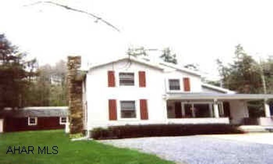 DARLING COUNTRY HOME WITH STREAM. LARGE 2 CAR DETACHED GARAGE.