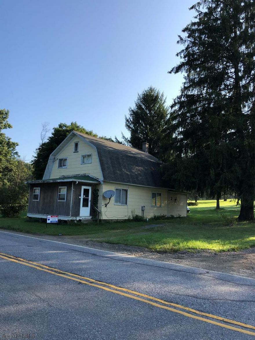 If you are looking for a spacious yard this is the one for you.  Property sits on over 3 acres.  City water and sewer only a few years ago.  Newer furnace.  Property is in the process of being cleared out - more photos to follow.
