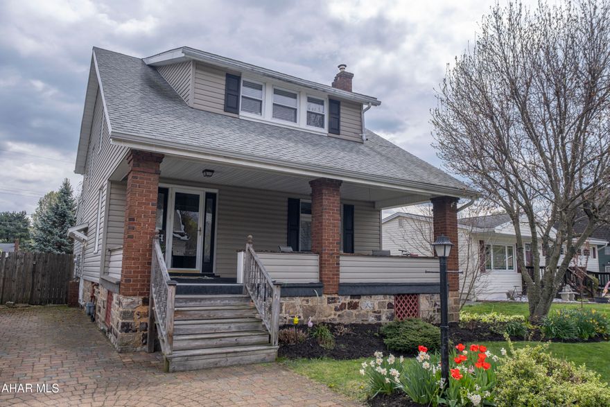 This classic Cape Cod style  home features a functional kitchen and a family room anchored by a cozy fireplace. The main floor includes a primary suite with a full private bath, while the second level offers three bedrooms, a second full bathroom, and a versatile bonus room--all finished with brand-new laminate flooring. Outdoor living is a highlight, featuring both large covered front and back porches, an above-ground pool, and a fully fenced backyard. Recently expanded with a newly added main-floor bedroom, this home offers a refreshed, spacious layout inside and out.