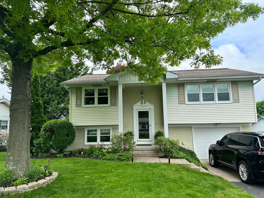 Beautifully maintained Penn Farms split entry home. The exterior is vinyl and brick, with lush landscaping surrounding the property. The interior is meticulously maintained, 3 bedrooms, 2 baths, lower level rec room with patio doors to a privacy fenced area with patio, deck, and hot tub. New windows are a bonus. Walk to historic intown Hollidaysburg. Enjoy views of Chimney Rocks.