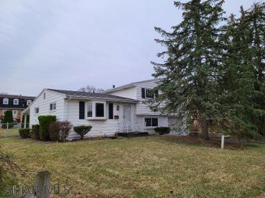 Open House:  Sunday, April 3rd, 1-3 p.m.  This multi-level home has a lot to offer.  Features include vinyl siding; hardwood floors; a finished family room; an attached garage w/garage-door opener; a paved driveway; a bay window; a bright, white kitchen with a stove, refrigerator; a covered patio; a newer hot water boiler; double-pane windows; arborvitae trees bordering the back of the property; sidewalks; and a gated, fenced in back yard.