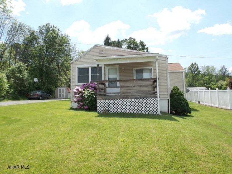 Cozy and private! with low utility costs (Water/sewage avg $45, Electric avg $85, Gas average $75-85)- One story living offers 2 Bedrooms (one is very large) with large closet, the other one has a closet/bonus room (large enough to also put computer desk inside like seller had before)  Enjoy the private closed in back porch that faces the woods at rear of home.  Have parties, cookouts, sleep overs in the tents with the kids, etc...................private yet convenient to most.  LOW taxes are just one plus to this home; not to mention it's move in ready as the pictures will show.  Call listing agent today to schedule your private tour.  Don't wait!