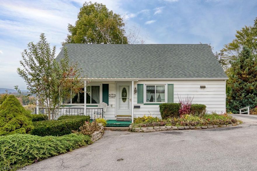 Some updates in 2013, this 3 bedroom, 1.5 story home has many desirable ammenities! Lot is .31 acre with deck in back, Sun Room is vented for heat/AC, Full bedroom 1st floor, large Living Room, eat in kitchen, 2 bedrooms and full bath 2nd floor, covered front porch, basement has some finishes, 1.5 bath with walk out, off street parking for multiple cars. See pictures to appreciate!