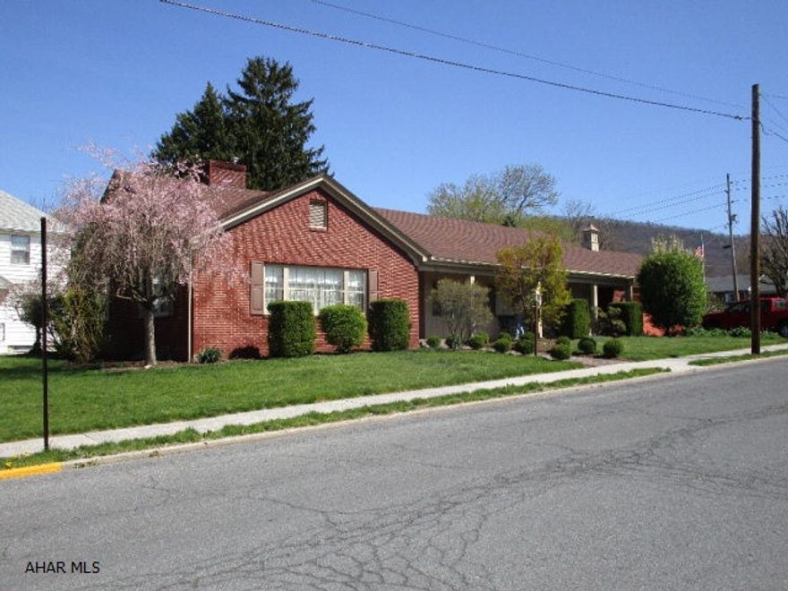 This quality brick rancher has so much to offer!! Large living room w/ wood FP, hardwood floors & crown molding, kitchen with cherry cabinets, formal dining with hardwood floors & crown molding, three bedrooms including a master suite w/ bath & main level laundry. Full basement w/ family room & FP and workshop. Natural gas heat with central air conditioning. Two-car attached garage, front covered porch, rear covered patio w/ canopy and professional landscaping.  Large street to alley lot. Bedford Borough location and convenient to all amenities. This is a quality built home that has been nicely updated and very well maintained!!