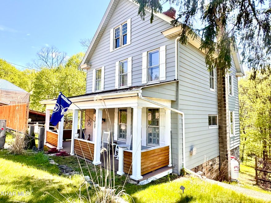 Step back in time while enjoying modern comforts in this beautifully remodeled 1861-built home, one of the first properties in the Isett ''The Mill'' development. Nestled in the heart of Central Pennsylvania, just 18 miles south of State College, this charming retreat offers breathtaking views of Spruce Creek from its inviting covered porches and patios.

Brimming with character, the home showcases original gingerbread details, stunning woodwork, and historic doors—complete with an old-fashioned doorbell!! A perfect blend of old and new, it features a cozy gas insert fireplace, a pellet stove for added warmth, and thoughtfully integrated modern updates.

Currently used as both a second home and a successful Airbnb, this property offers exceptional versatility. Outdoor enthusiasts will love the world-class fly fishing access, as well as the nearby hiking and biking trails that make Spruce Creek a sought-after destination for nature lovers.

Whether you're looking for a peaceful getaway, an investment opportunity, or a one-of-a-kind residence, this historic gem is a must-see!